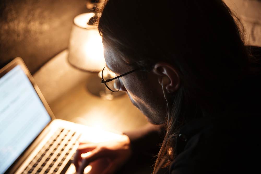 concentrated-man-using-laptop-computer-home(1)